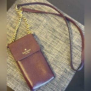 Kate Spade cross body cell phone/card holder. Deep purple colour.